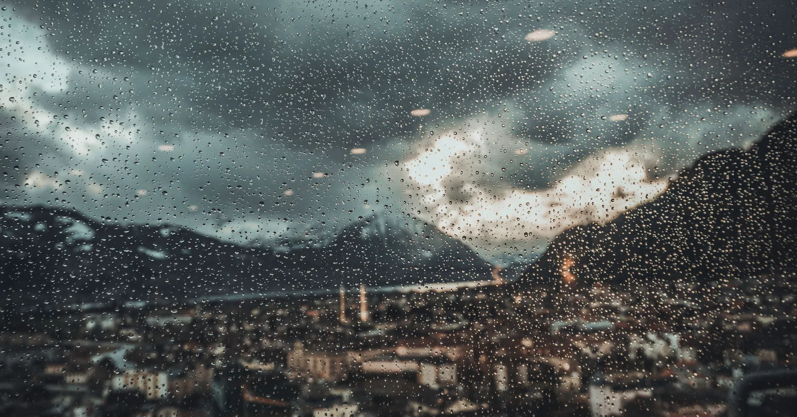A wet window over a harbour town