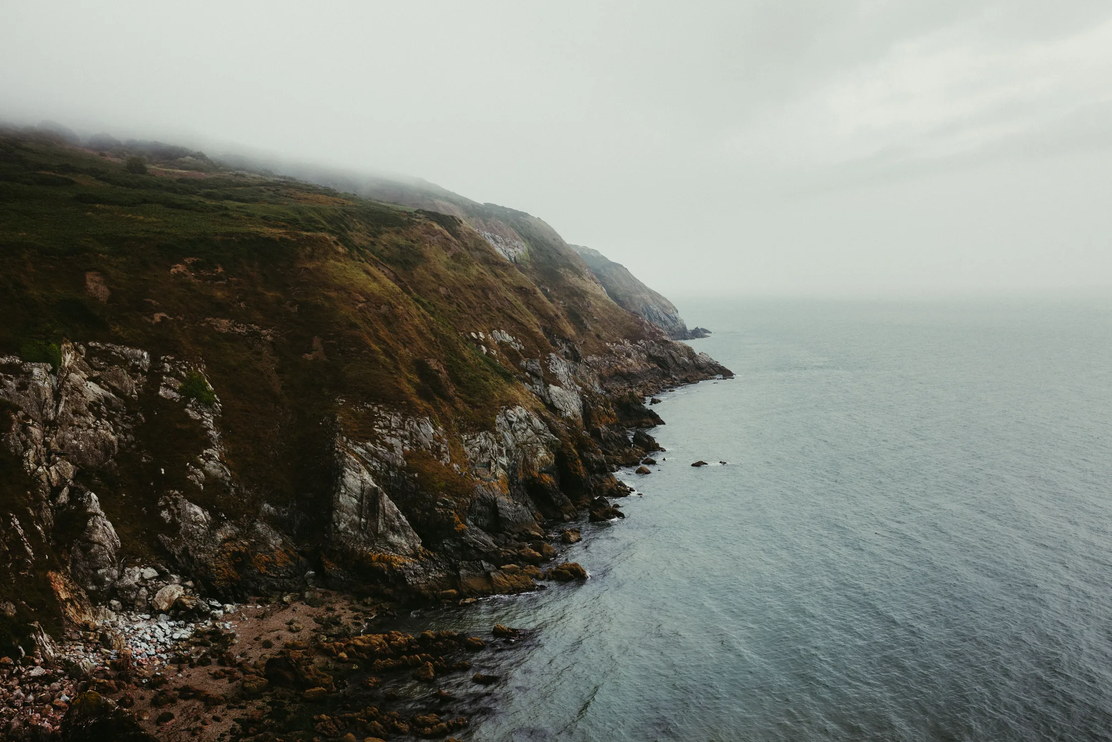A headland under low cloud, out of season